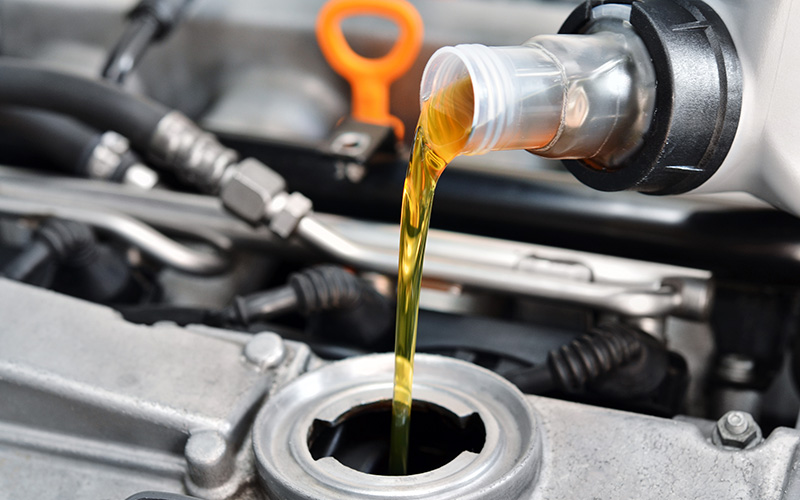 Changing motor oil to lubricate car engine